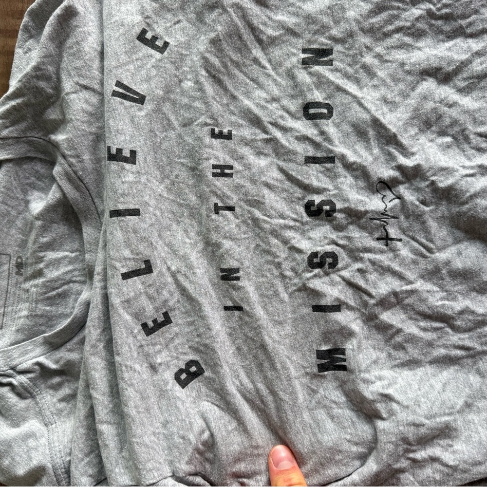 Tim Tebow grey shirt